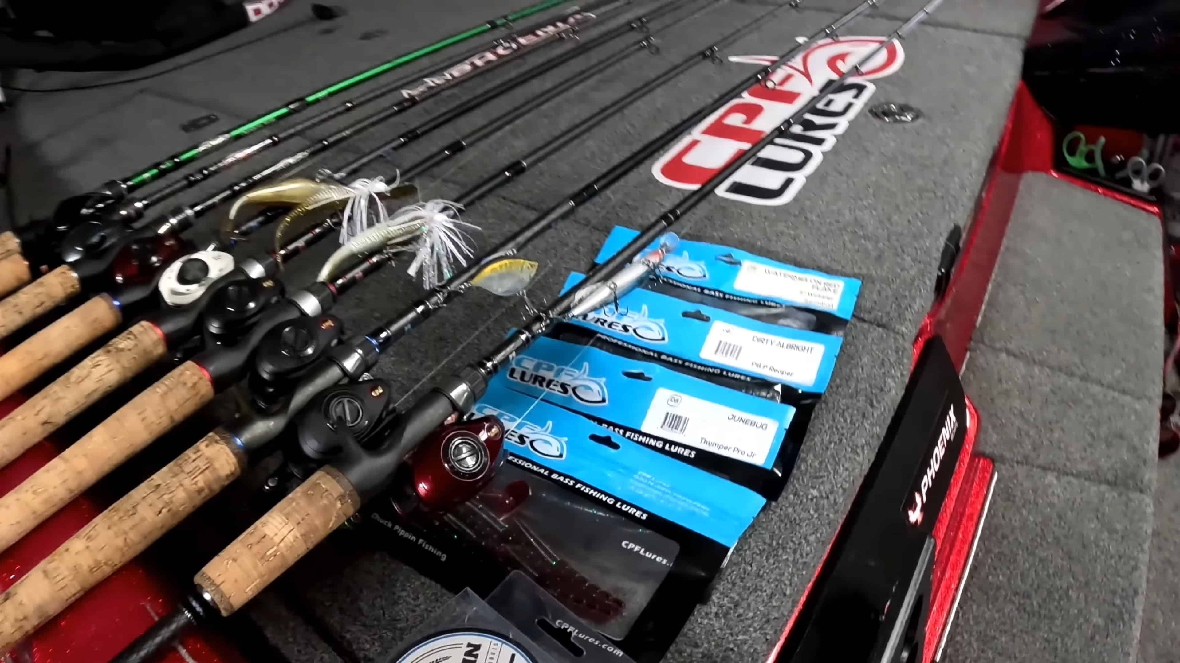 Fishing rods reels and lures arranged on a bass boat