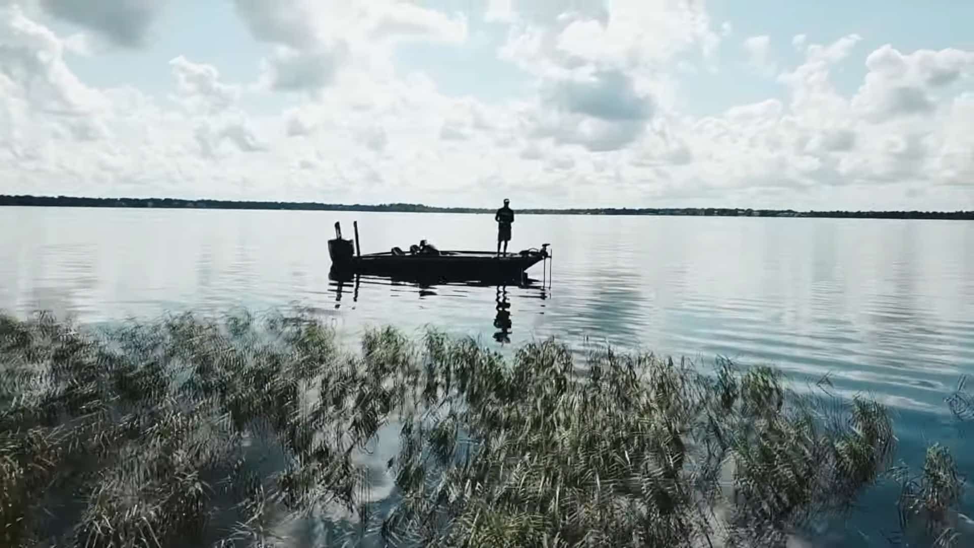 Bass boats fishing on calm Lake Toho water